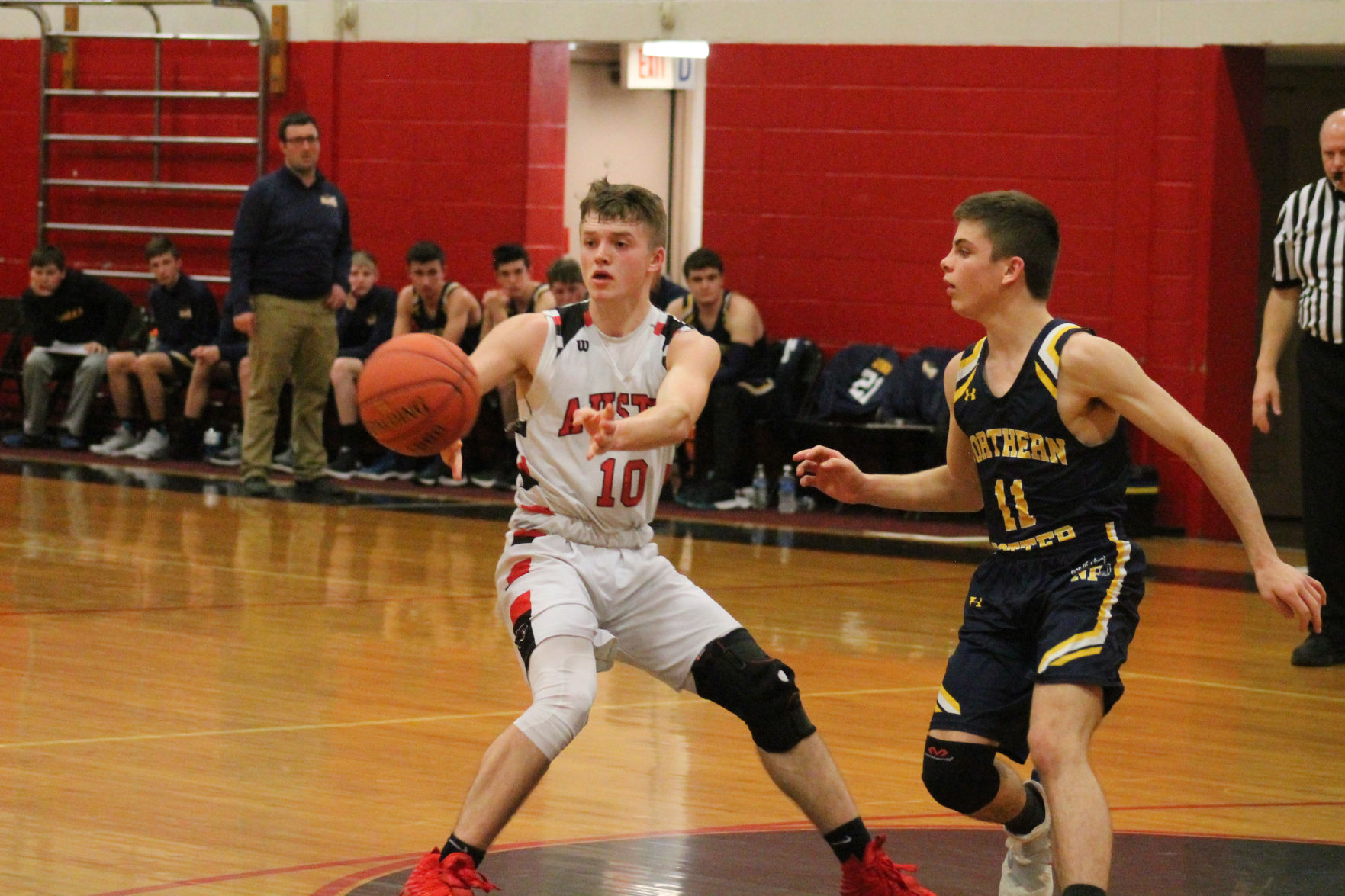 Austin rallies past NoPo, 56-53, for 1st playoff win since 2001